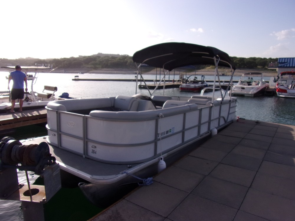 a boat is docked next to a body of water