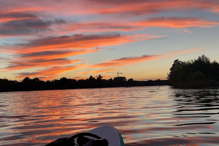 a sunset over a body of water