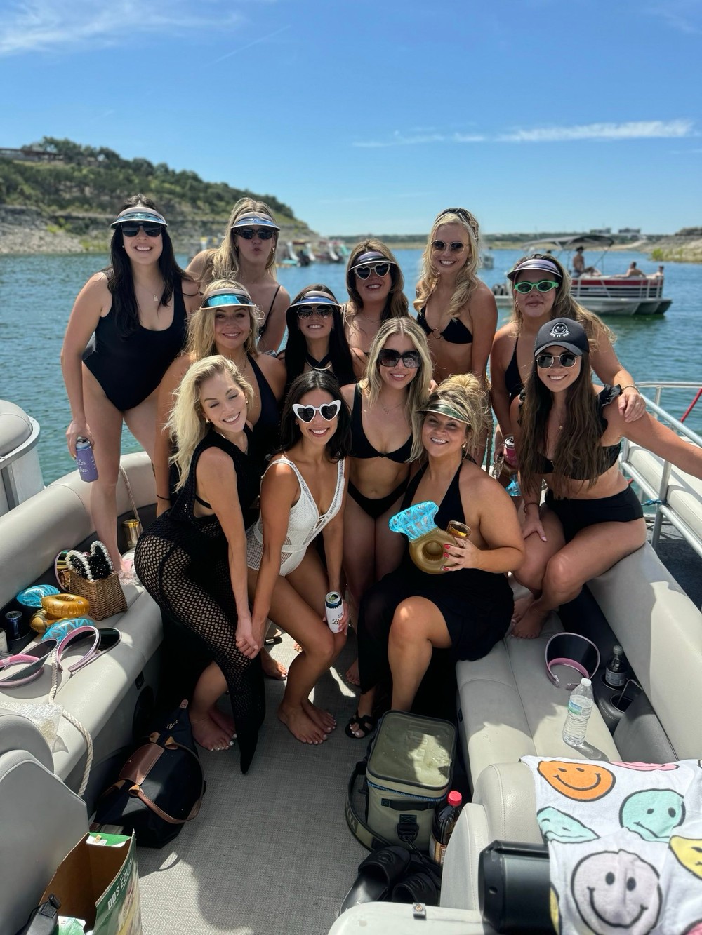 a group of people on a beach posing for the camera