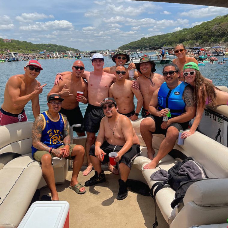 a group of people sitting at a beach