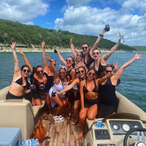 a group of people on a boat in the water