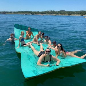 a group of people swimming in a body of water