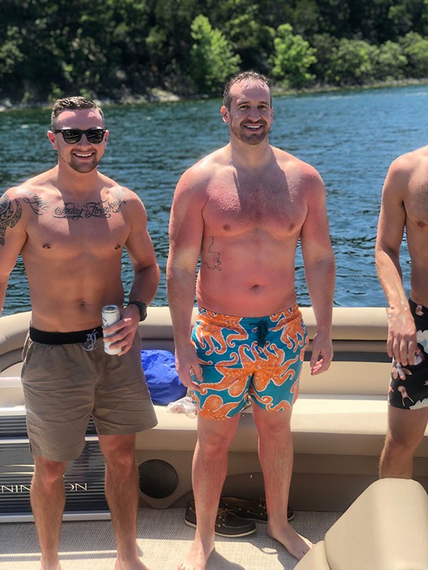 a group of people standing in the water