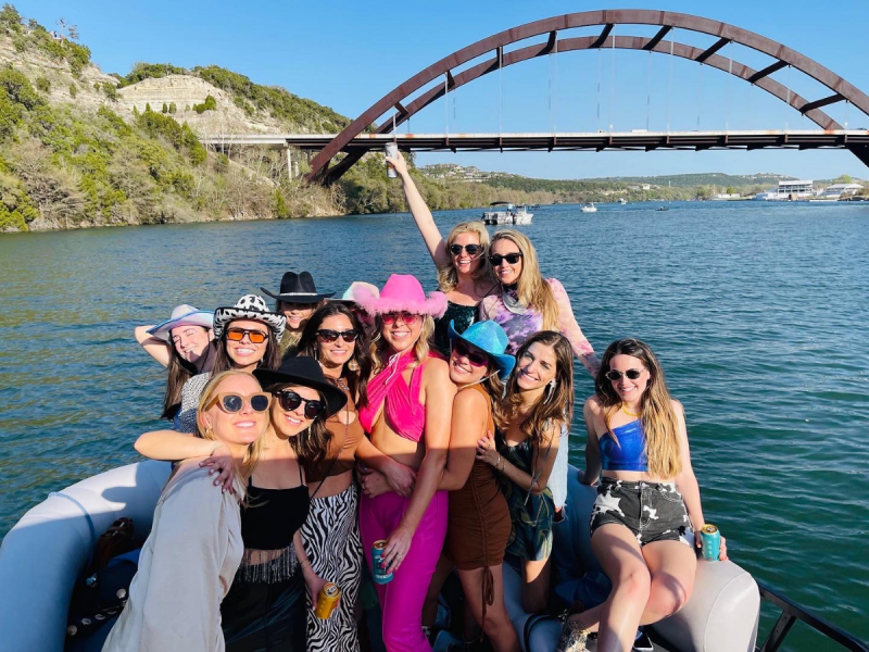 a group of people in a boat on a body of water