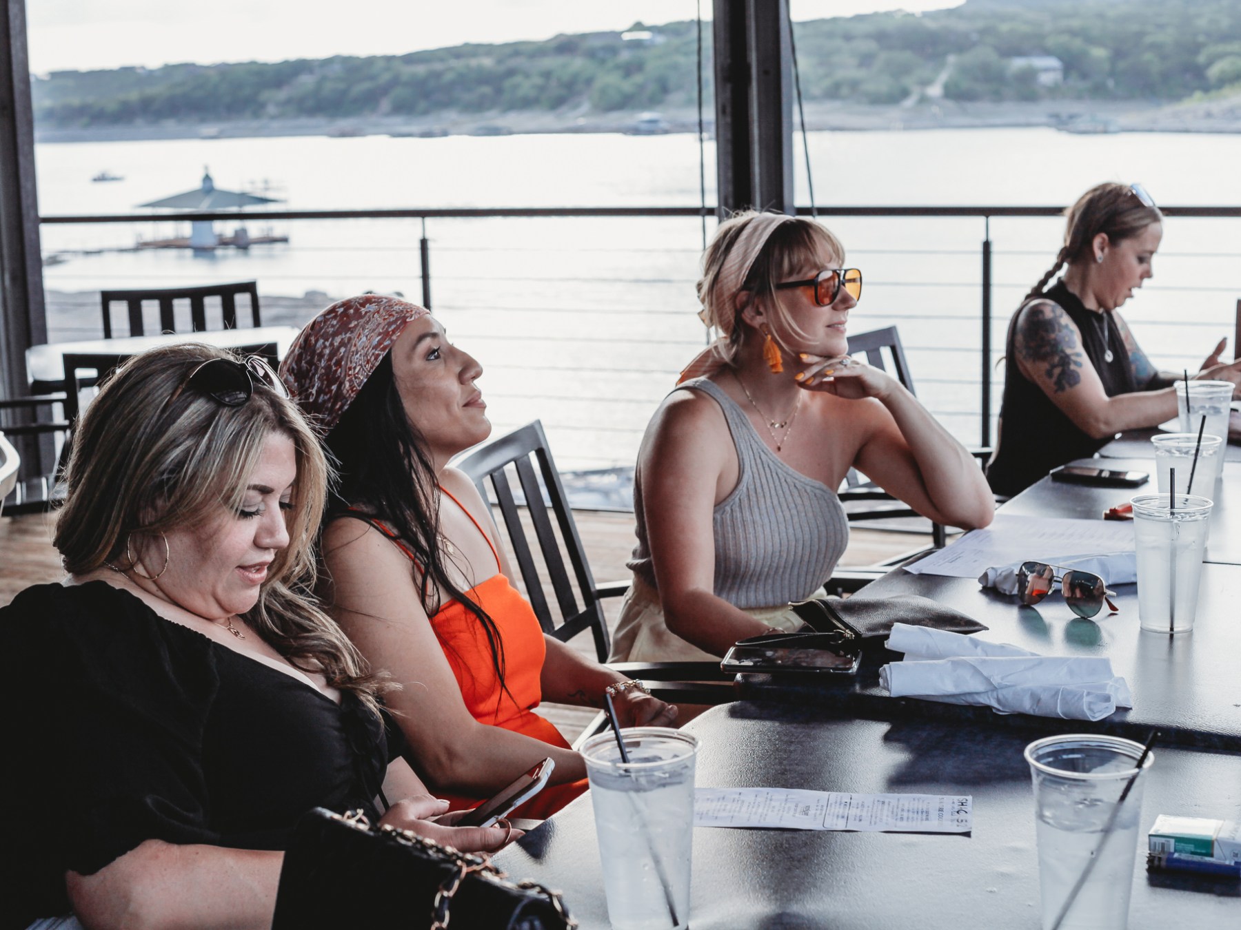 Kelly Clarkson et al. that are sitting on a boat in the water