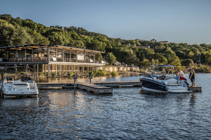 a boat is docked next to a body of water