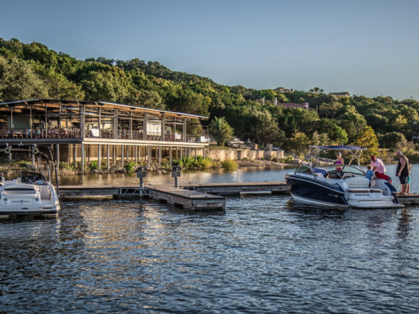 a boat is docked next to a body of water