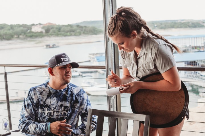 a man and a woman sitting at a beach