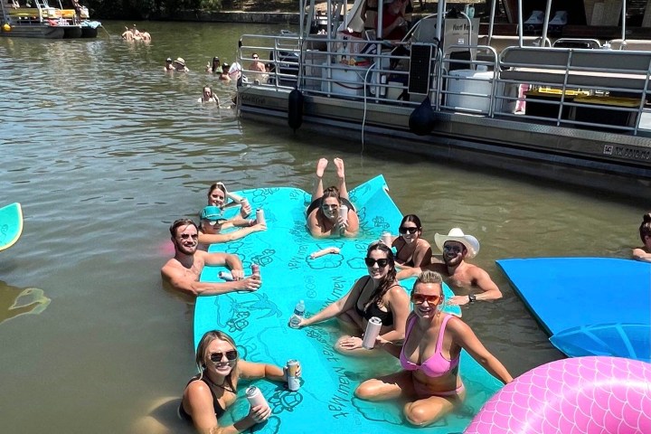 a group of people swimming in a body of water