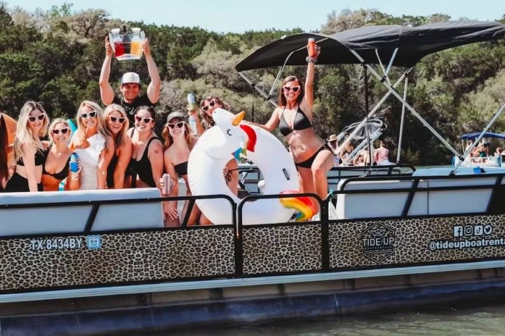 a group of people riding on the back of a boat