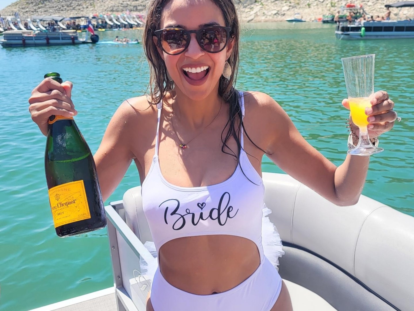 a woman standing next to a body of water