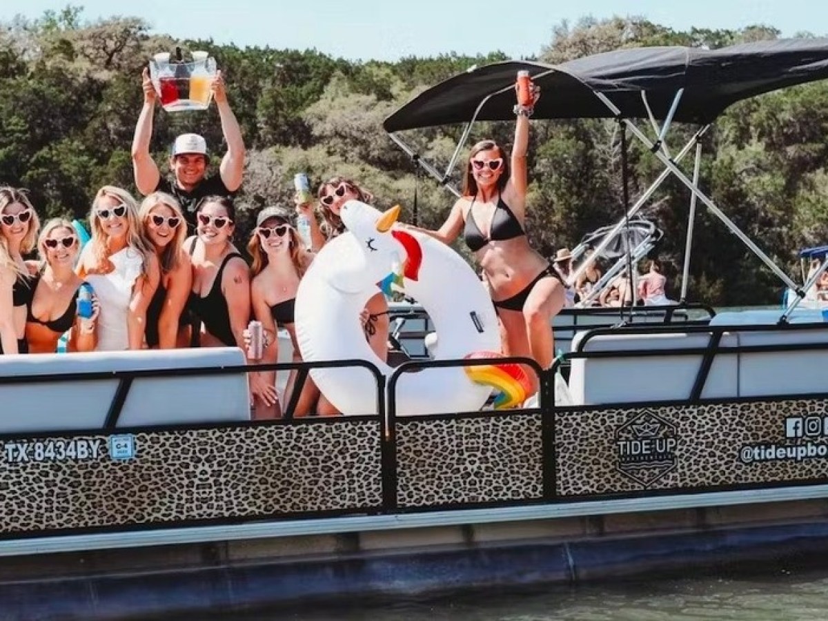 a group of people riding on the back of a boat