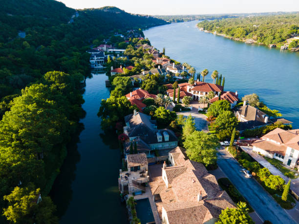 a group of people standing next to a body of water