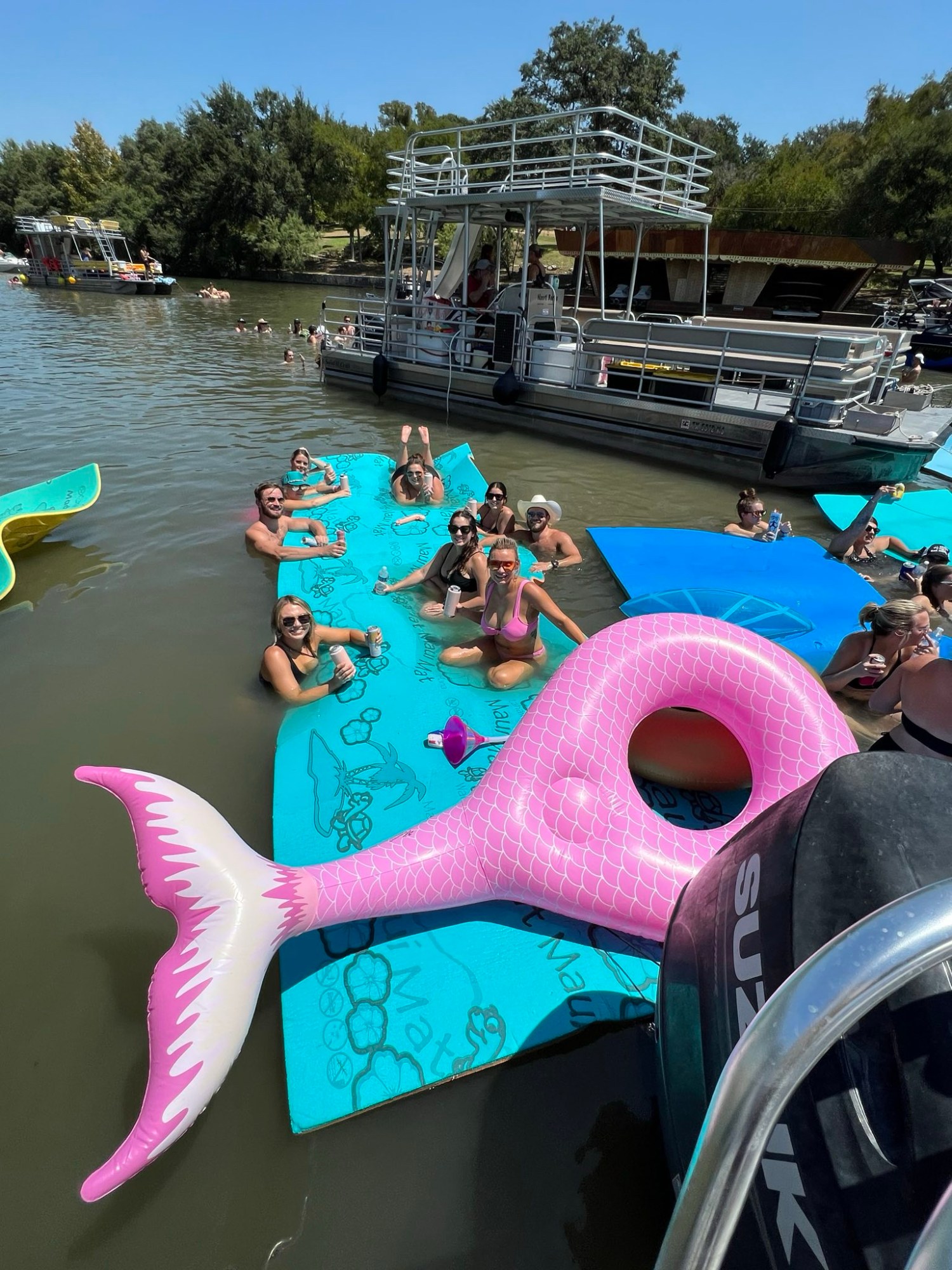 a group of people on a boat in the water